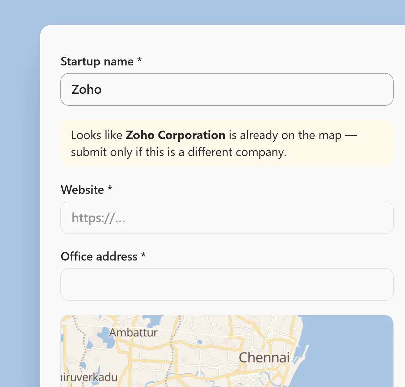 The submit form with Zoho typed as the startup name and the warning that Zoho Corporation is already on the map, above the website and office address fields and the optional map pin